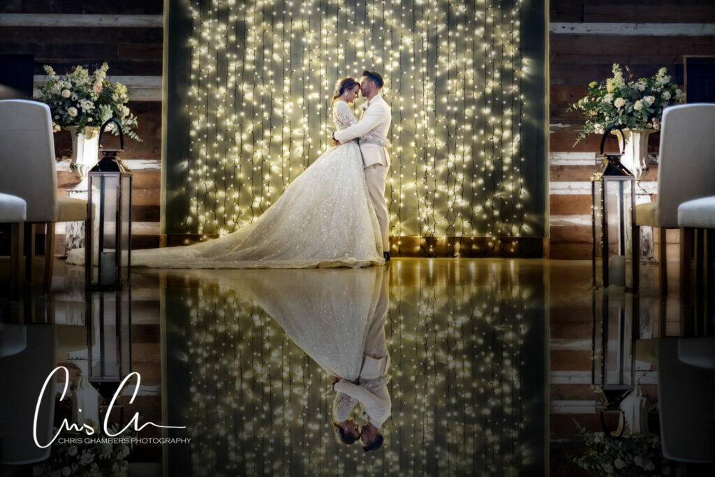 Wharfedale Grange wedding photography in the North Barn. Bride and groom reflections