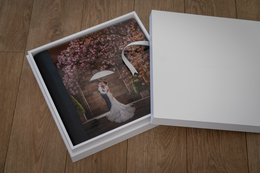 Exclusive Graphistudio Storybook Wedding album featuring Charlotte and Nick's wedding photographs at Rudding Park near Harrogate. 