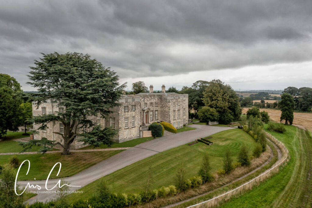 Hazlewood Castle wedding venue near York. Aerial view of the front of the castle and grounds