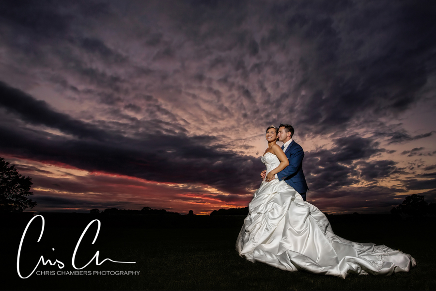 Sunset wedding photograph of a bride and groom at Allerton Castle North Yorkshire. 