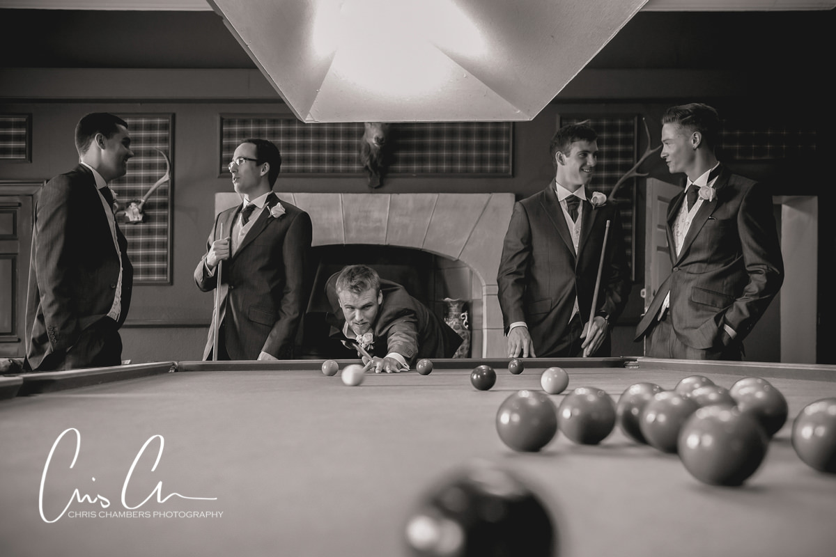 The groom and groomsmen in the Billiard room at Swinton Park near Masham wedding