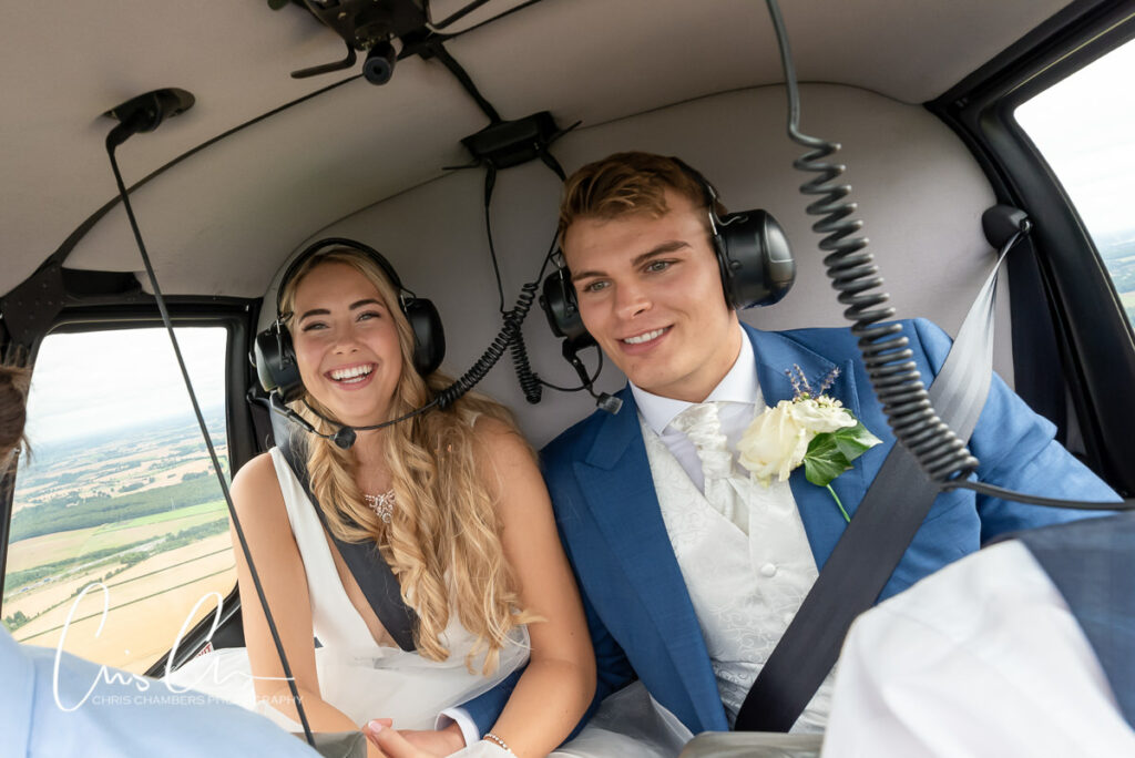 bride and groom inside the helicopter on their wedding day