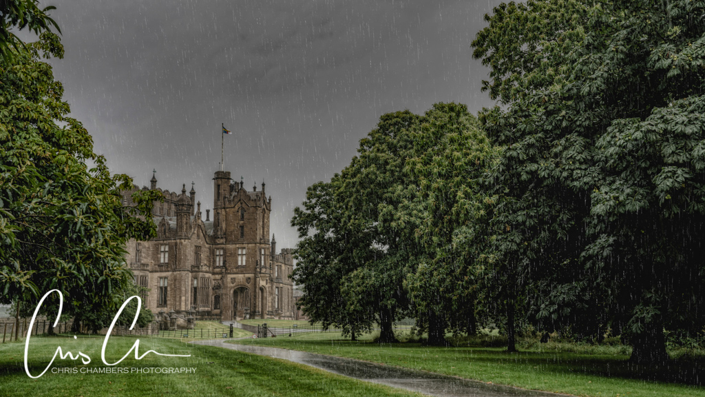 Allerton Castle fairytale North Yorkshire wedding venue, photographed from the driveway in heavy rain. Beauty and the Beast Themed wedding. 