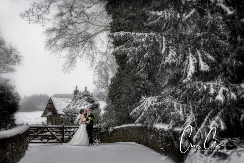 Bride and groom in the snow at Bagden Hall West Yorkshire wedding venue