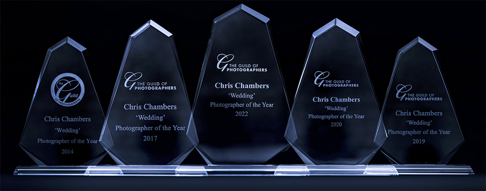 Collection of crystal photography awards on display.