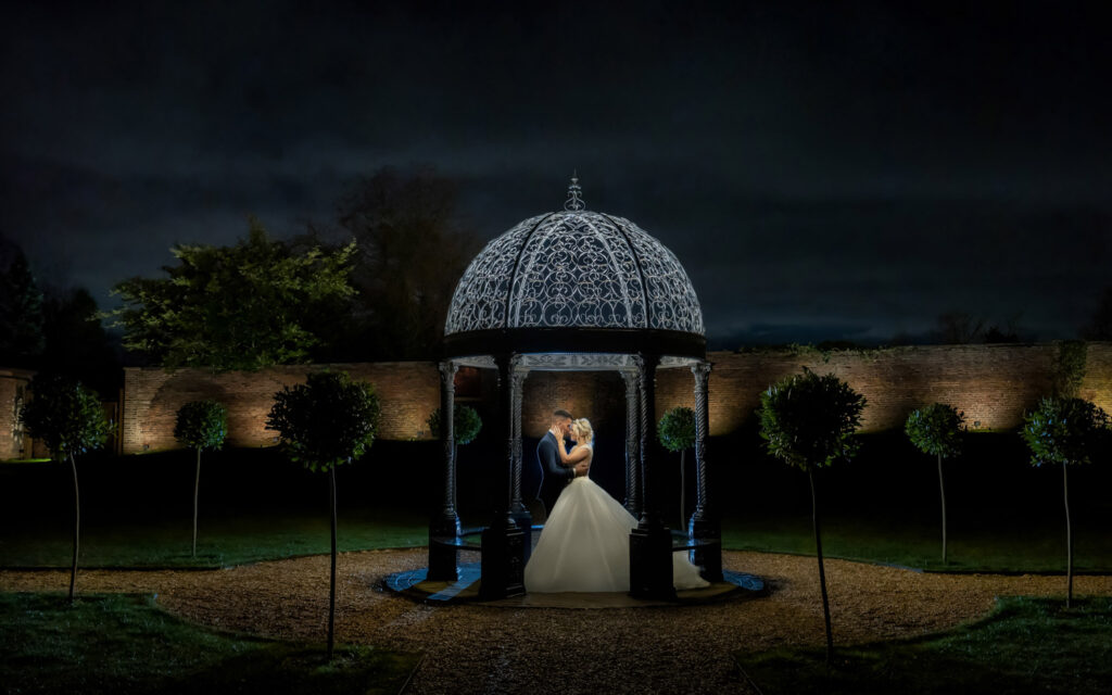 Couple embracing in the gazebo at Foxtail barns Staffordshire