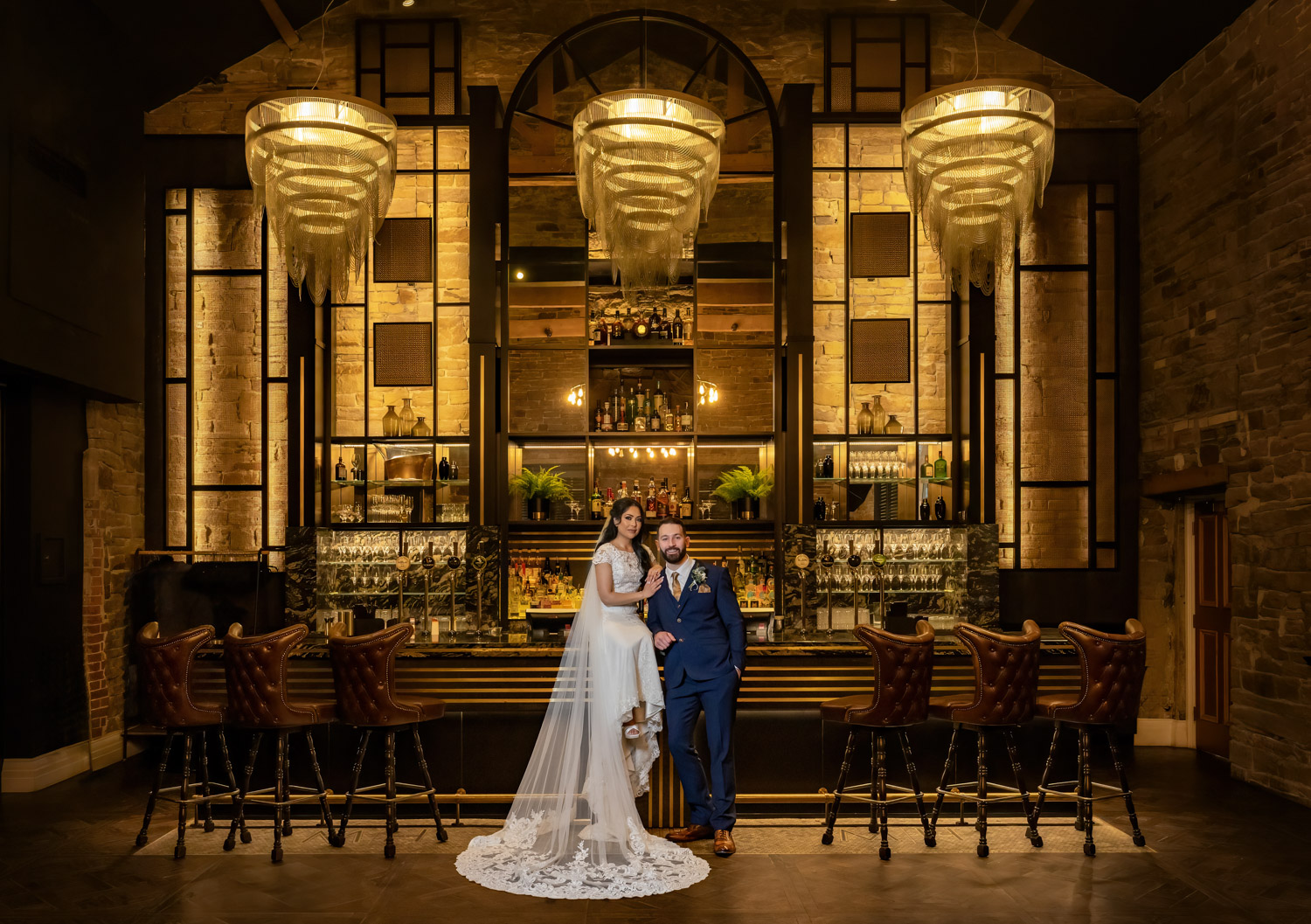 Couple posing in the Coach House bar at Manor House Lindley. Yorkshire wedding photographer Chris Chambers