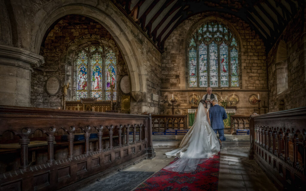 Wedding ceremony in historic church interior. Chris Chambers Yorkshire wedding photographer