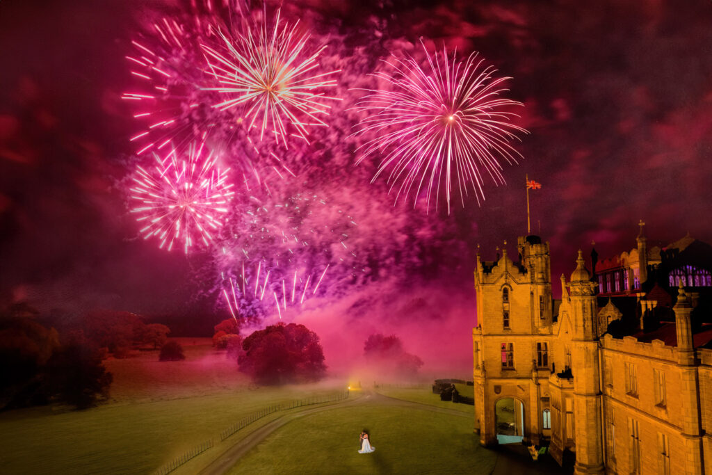 Allerton Castle firework display with the bride and groom watching. Wedding photography at Allerton castle