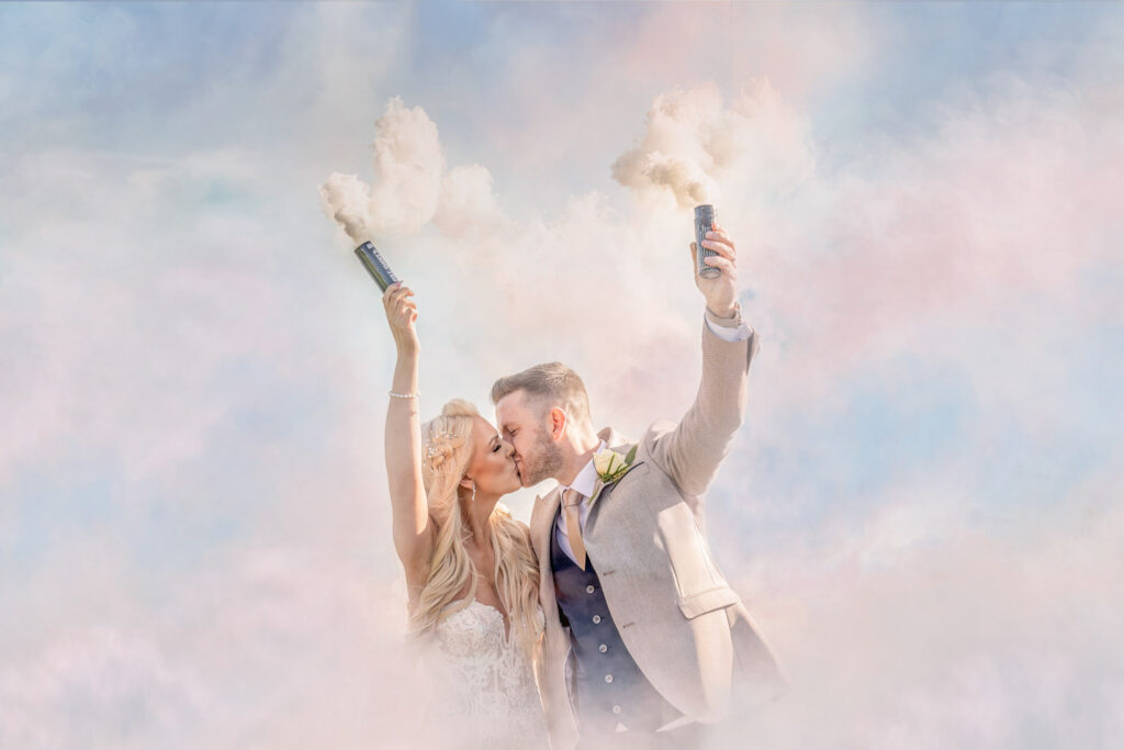 Couple with smoke flares celebrating wedding.Chris Chambers Yorkshire wedding photographer