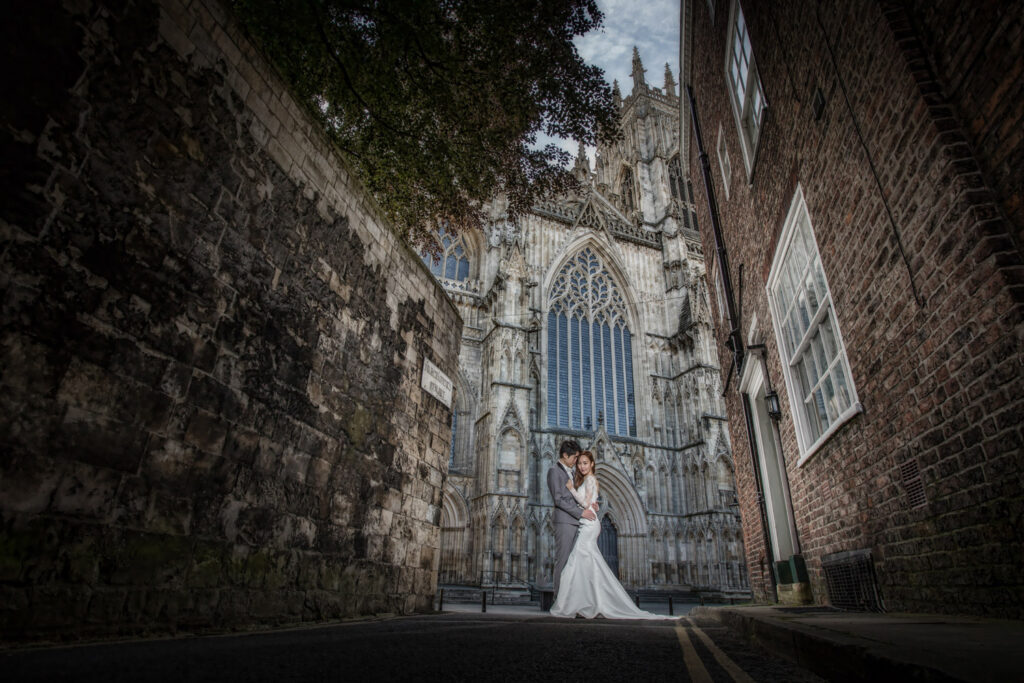 Bride and groom with York Minster as a backdrop. Chris Chambers Yorkshire wedding photographer