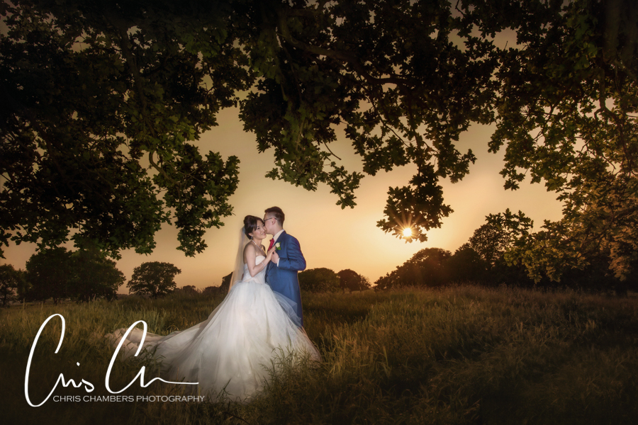 Allerton Castle wedding photograph showing the bride and groom at sunset