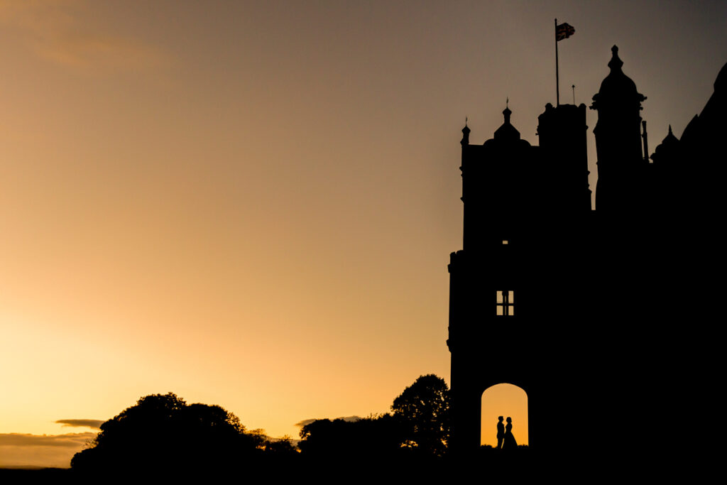 Silhouette of Allerton castle and couple at sunset. Wedding ceremony in the Great Hall at Allerton Castle. Wedding Photography from Chris Chambers
