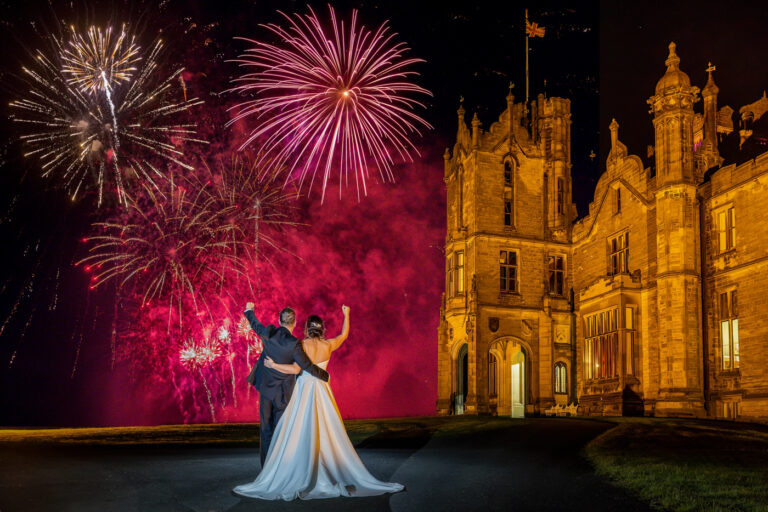 Bride and groom watch the fireworks at Allerton Castle. Allerton Castle wedding photographer