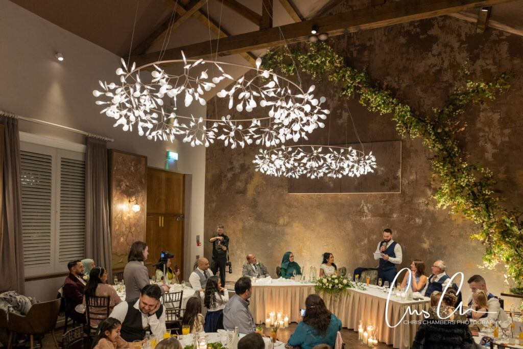 Manor House Lindley weddings. wedding reception with guests and decorative lighting.