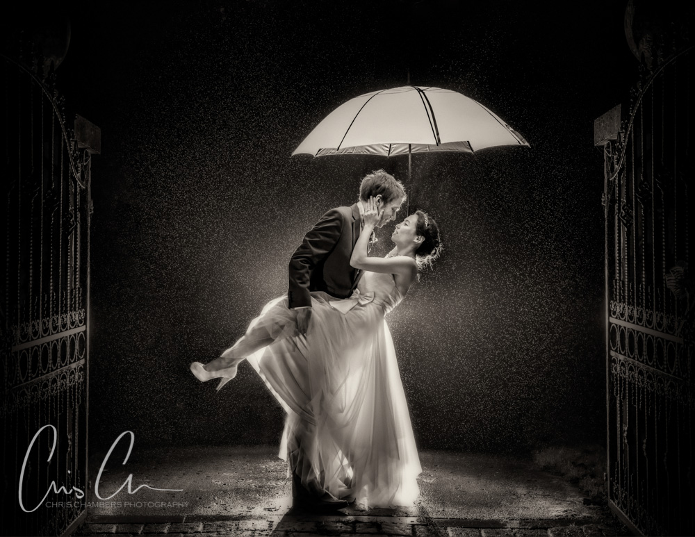 Bride and groom in the rain at Hazlewood dCastle - wet wedding photography