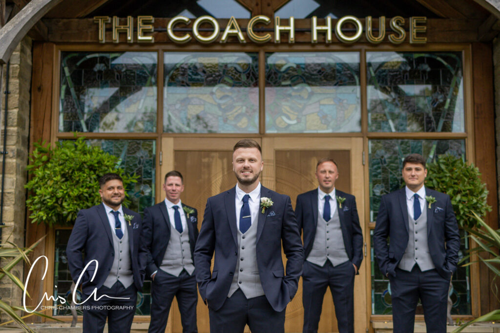 Groom and groomsmen outside The Coach House venue.