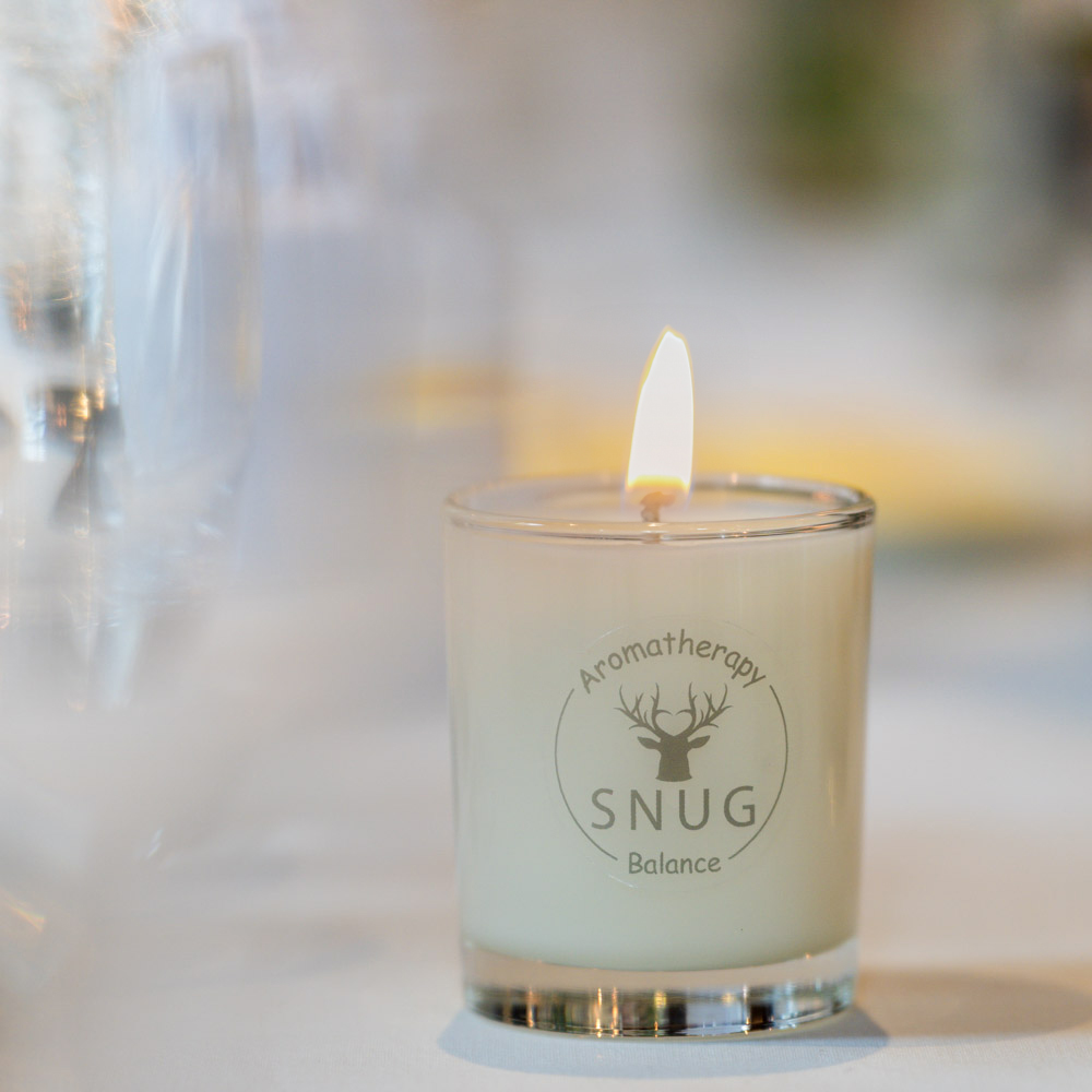 scent your wedding, a wedding day candle on the top table for wedding breakfast.