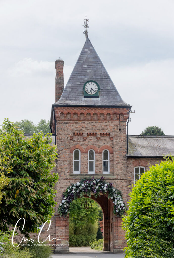 Solberge Hall clock tower and flower arch
