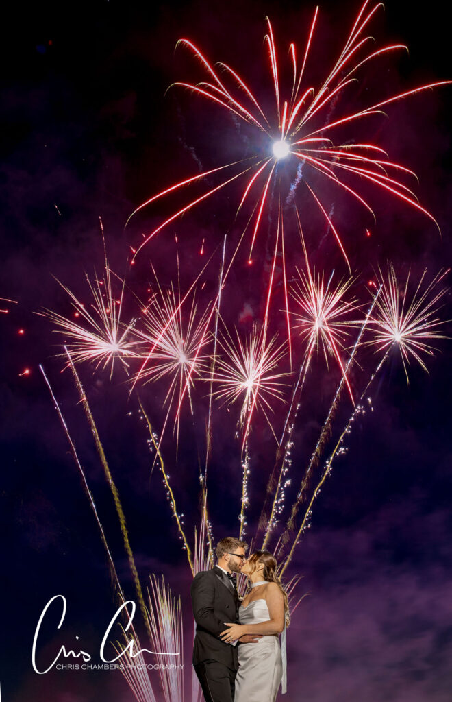 Fireworks at a wedding. Hazlewood castle wedding photography with Fireworks as the bride and groom stand with their firework display