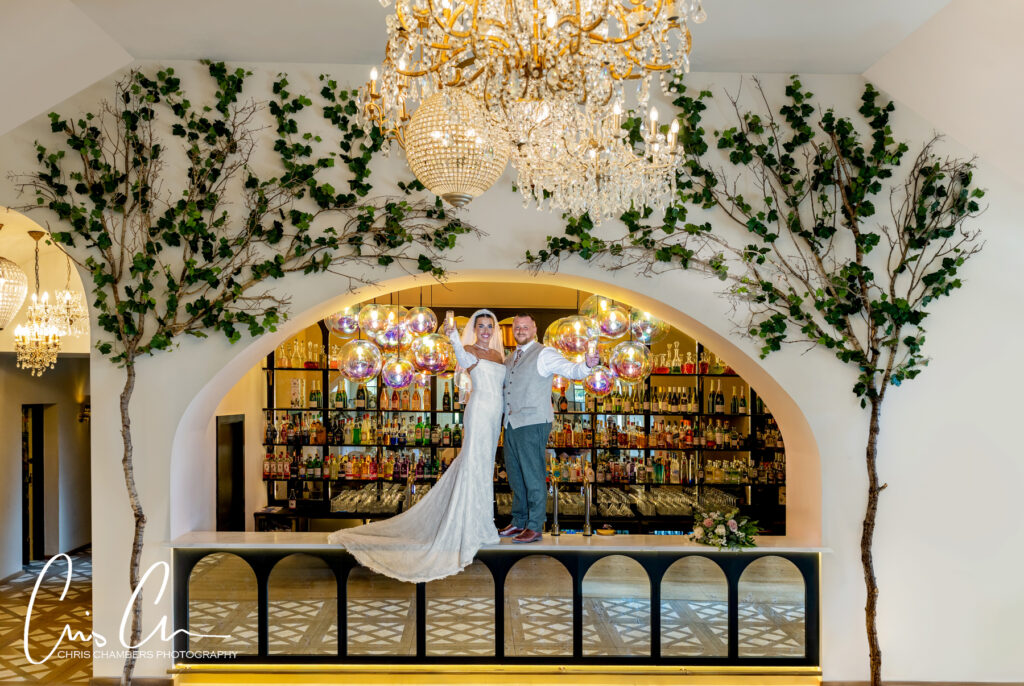 bride and groom on the bar at Solberge Hall. Yorkshire wedding venue. 