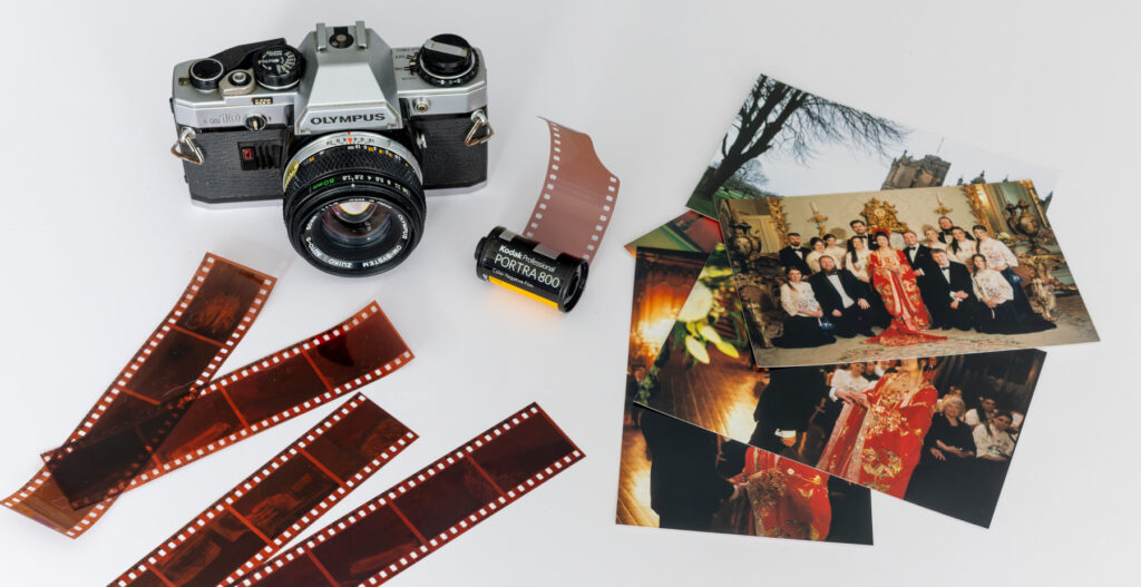 Vintage 35mm film camera and colour film used for analogue wedding photography