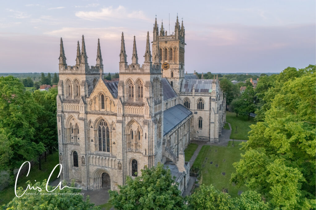 Selby Abbey - aerial view of the Abbey wedding venue at sunset. Award winning wedding photography from Chris Chambers 
